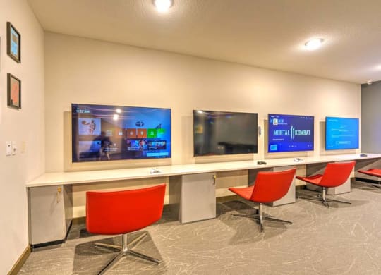 a room with three televisions on the wall  at Fusion, Jacksonville, FL, 32256