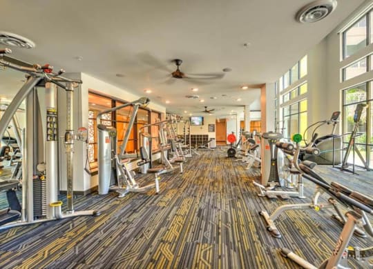 a room filled with lots of different types of exercise equipment  at Fusion, Florida, 32256
