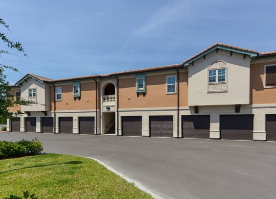 a building with a parking lot in front of it  at Hacienda Club, Florida