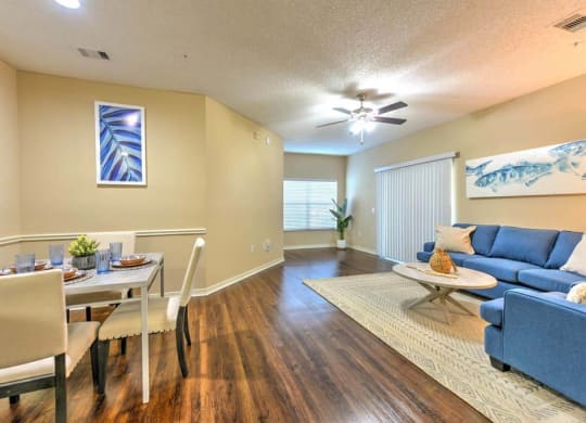 a living room with a couch and a table  at Ocean Park, Jacksonville Beach, FL, 32250