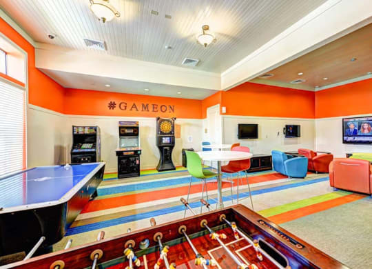 a game room with a foosball table and a ping pong table  at Hacienda Club, Jacksonville, Florida