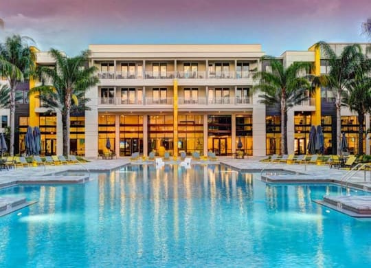 a large swimming pool with a large building in the background  at Fusion, Jacksonville, Florida