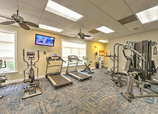 our apartments showcase a gym with equipment and a flat screen tv  at Ocean Park, Jacksonville Beach, 32250