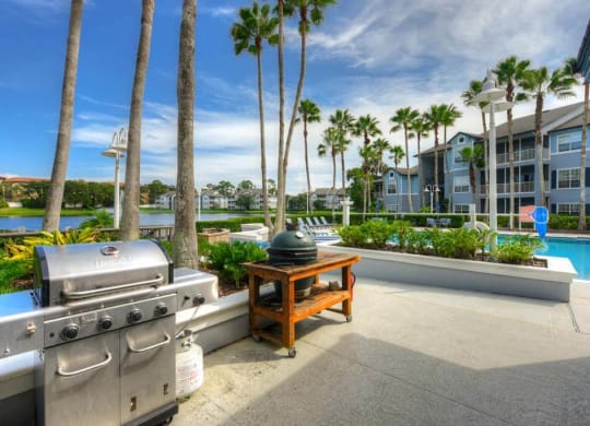 a barbecue grill sitting next to a table with a kettle on it  at Ocean Park, Florida, 32250