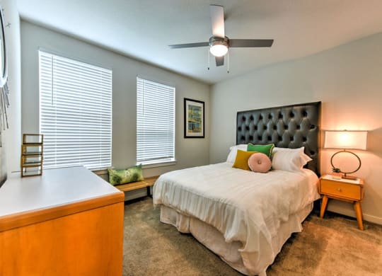 a bedroom with a bed and two windows  at Fusion, Jacksonville, FL, 32256