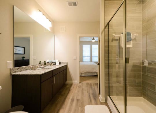 a bathroom with a shower sink and toilet  at Luxor Club, Jacksonville