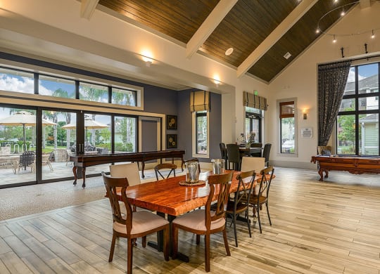 a large gathering room with a pool table and ping pong table  at Cabana Club - Galleria Club, Jacksonville, FL