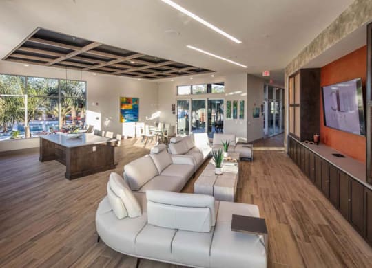 a living room filled with furniture and a large window  at Luxor Club, Jacksonville
