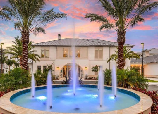 a house with a fountain in front of it  at Palm Bay Club, Jacksonville, Florida