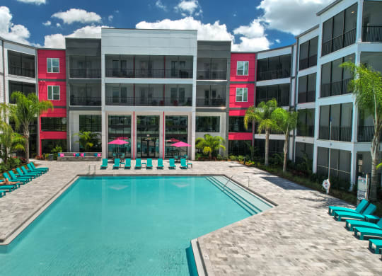 a swimming pool in front of an apartment building at Pinnacle Apartments, Jacksonville, 32256