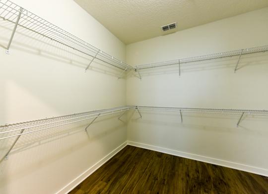 Empty room with white walls and wooden floor at Fusion Apartments, Jacksonville, Florida