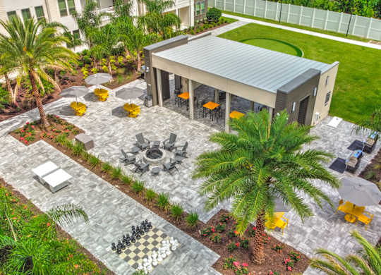 A modern house with a patio and a chess board in the garden at Fusion Apartments, Jacksonville, FL, 32256