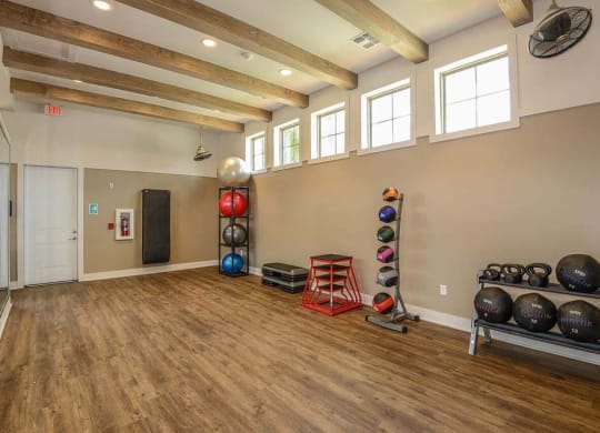 a room with a bunch of weights and mirrors in it  at Palm Bay Club, Jacksonville, Florida