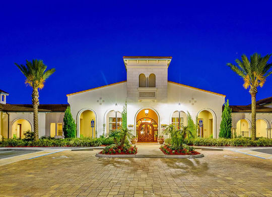 a house with a driveway and palm trees in front of it  at Hacienda Club, Jacksonville, FL, 32256