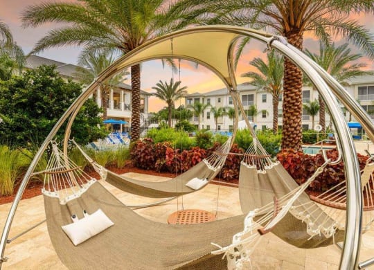 a hammock on the patio of a resort  at Palm Bay Club, Jacksonville, FL, 32258