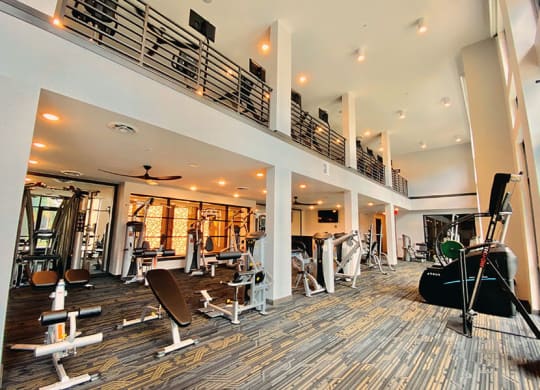 the spacious fitness center has a treadmill, elliptical and other exercise equipment  at Fusion, Florida, 32256