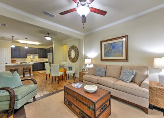 a living room with a couch and a ceiling fan at Hacienda Club, Florida