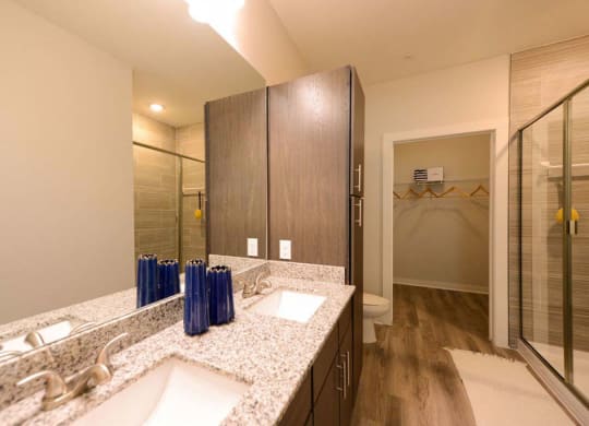 a bathroom with a sink and a mirror  at Luxor Club, Jacksonville, FL