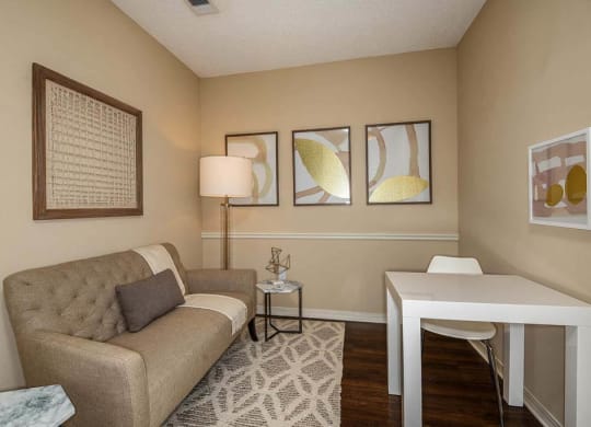a living room with a couch and a table  at Ocean Park, Jacksonville Beach, FL, 32250