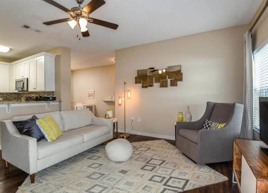 a living room with a couch and a chair  at Ocean Park, Florida, 32250