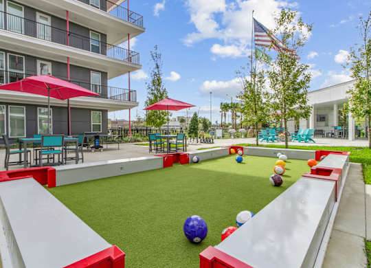 A playground with a slide, ball pit, and climbing wall.at Pinnacle Apartments, Jacksonville, FL