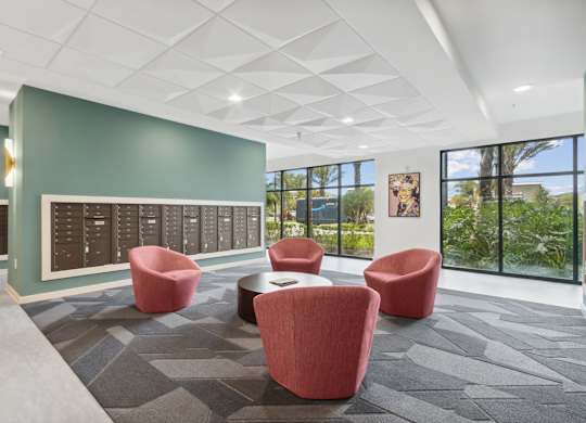 A room with a grey carpet and a white ceiling with a skylightat Pinnacle Apartments, Jacksonville, FL