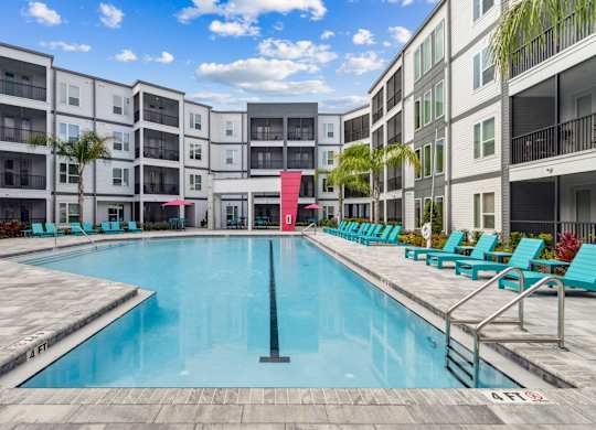 A large swimming pool in front of apartment buildings at Pinnacle Apartments, Jacksonville, FL