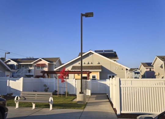 Mutual Housing at the Highlands units, park bench, fence