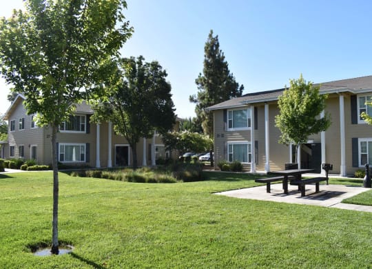 Mutual Housing on the Greenway barbecue area and unit exterior
