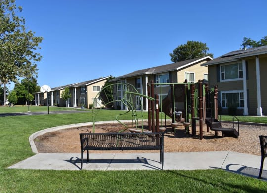 Mutual Housing on the Greenway bench near playground