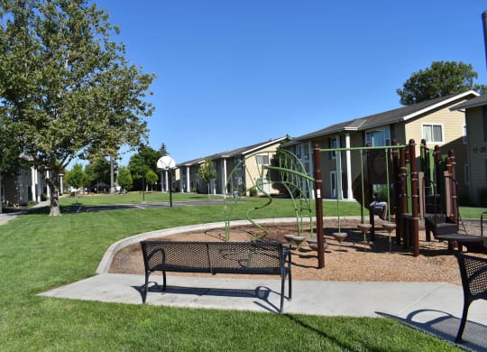 Mutual Housing on the Greenway bench near playground