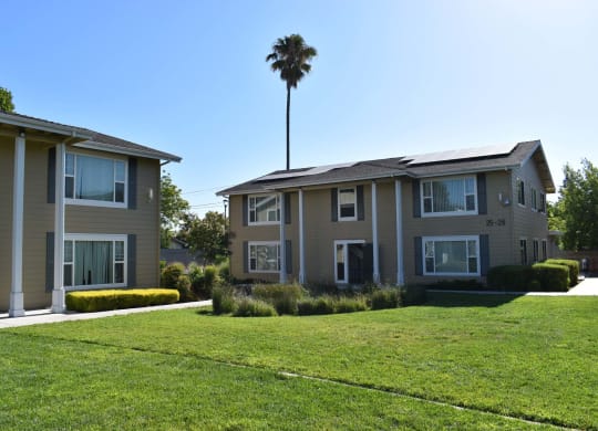Mutual Housing on the Greenway lawn and multiple building unit exterior