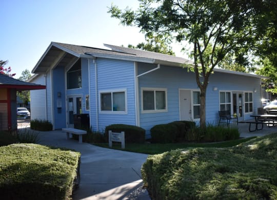 Moore Village Mutual Housing Community exterior building photo - office/community room