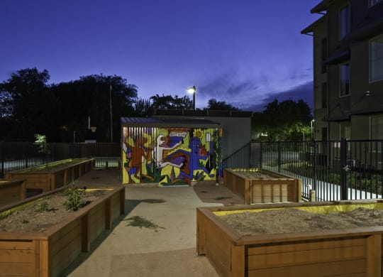 New Harmony Mutual Housing Community community garden at twilight