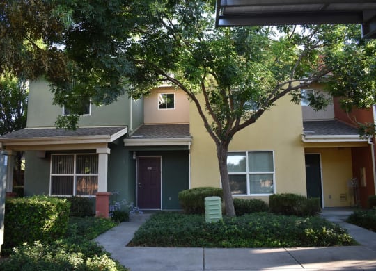 Tremont Green Mutual Housing Community tree-shaded unit exteriors