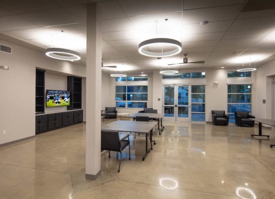 Large open community room with tables and chairs