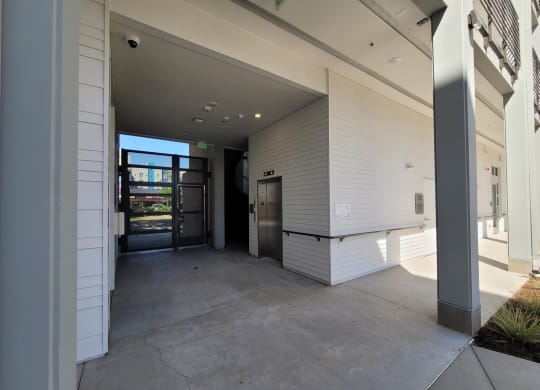Entry way at Lavender with gated entry, staircase, and elevator.