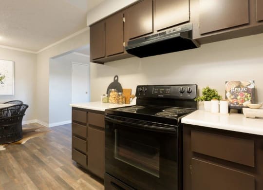 a kitchen with a stove and a microwave