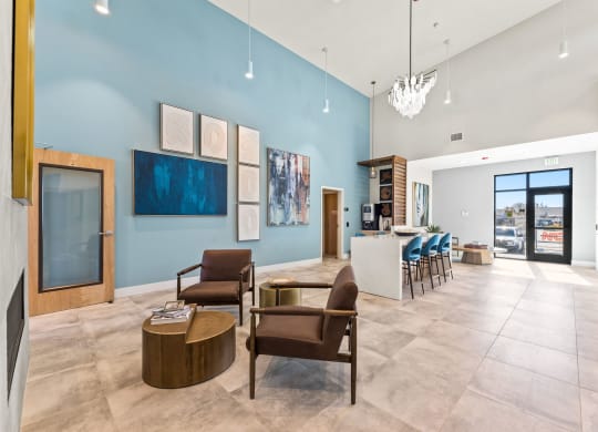 Marlette lobby with chairs and a bar and a blue wall