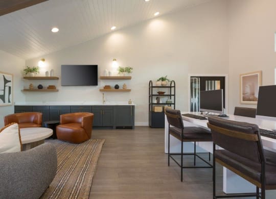 a living room with a table and chairs and a television