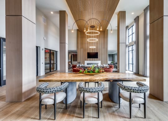 a large kitchen with a wooden table and chairs