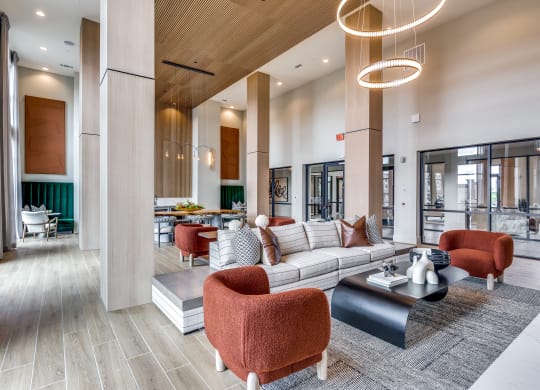 a large lobby with couches and chairs and a table