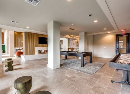 a game room with a ping pong table and a pool table