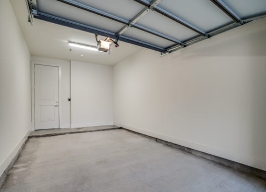 an empty room with a door and a white wall