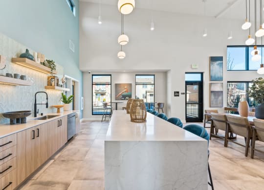 a large kitchen with a marble counter top and a dining room