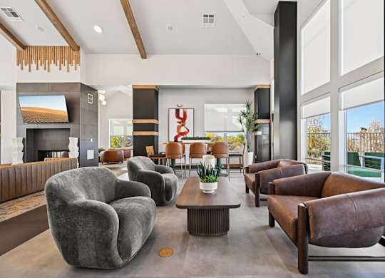 A modern living room with grey and brown furniture.