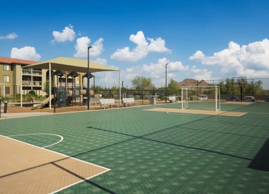 a tennis court with a building in the background