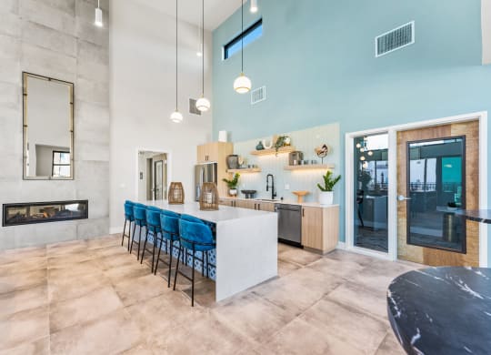 a kitchen and dining room with a bar and a fireplace
