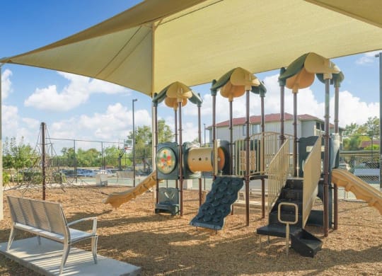a playground with a swing set and other playground equipment