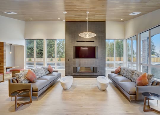 a living room with couches and a fireplace